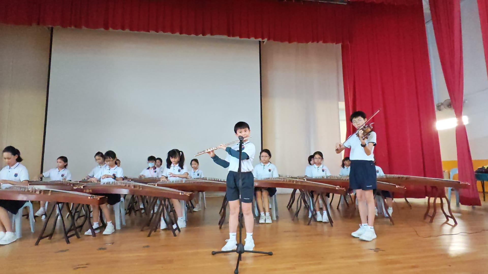 Students perform on school stage